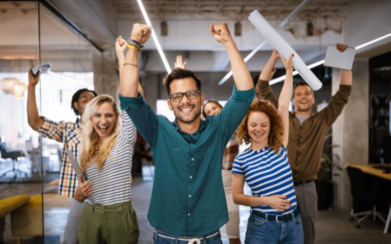 Employees celebrating and being productive